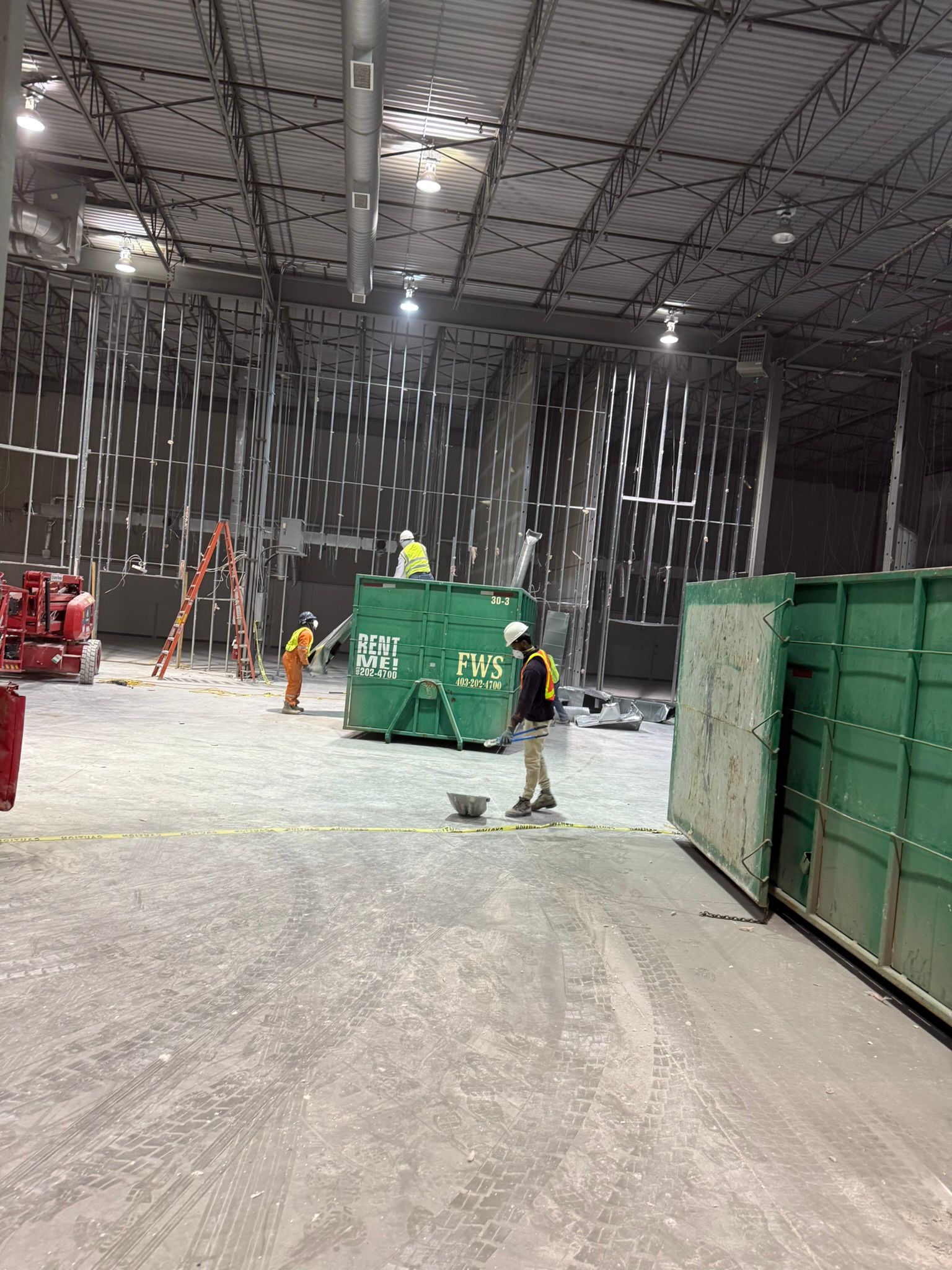 Commercial strip-out with crew in PPE
